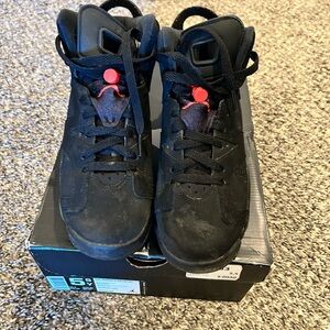 Black High-Top Sneakers with Red Accents